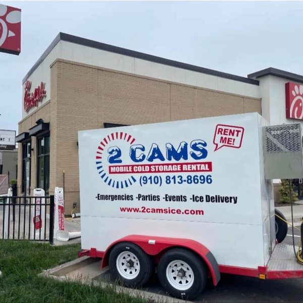 2 Cams Ice refrigerated trailer set up outside a Chick-fil-A restaurant