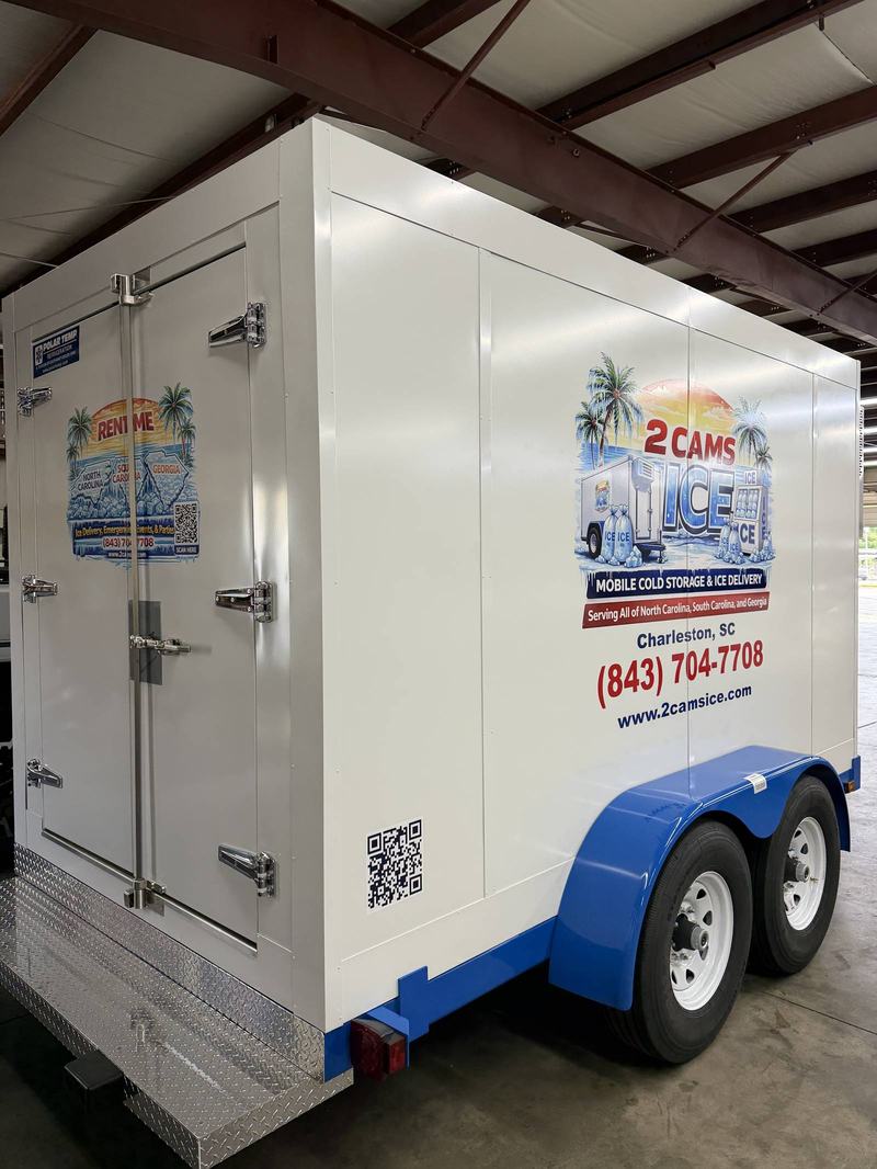 Rear doors of a 2 Cams Ice refrigerated trailer with the Rent Me decal and (843) 704-7708